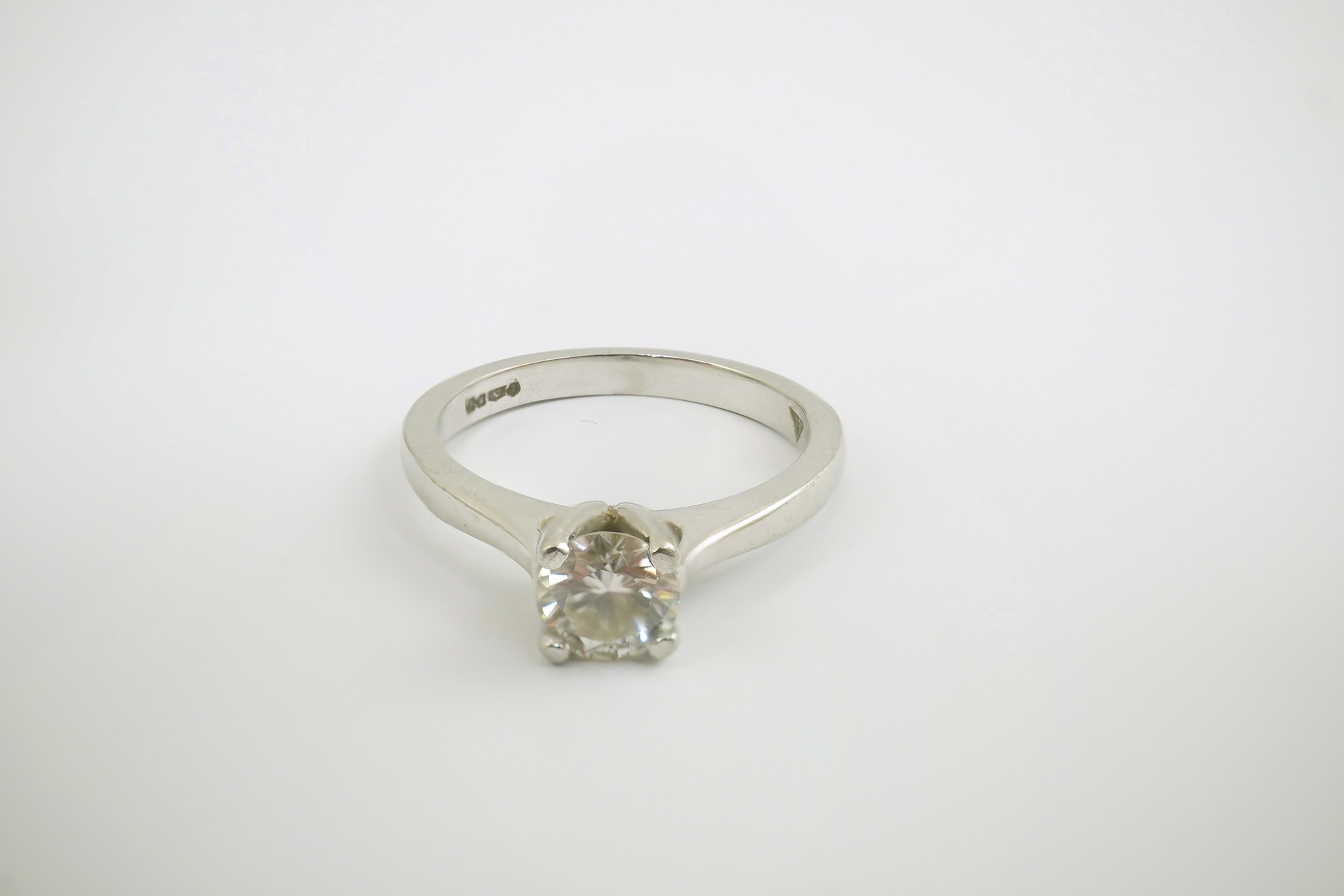 A modern platinum and solitaire diamond set ring